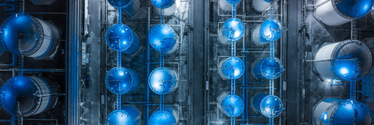 Storage tank of liquid chemical and petrochemical product tank, Aerial view at night.